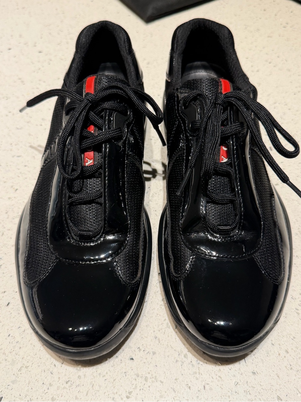 Prada America Cup Black patent leather Athletic Sneakers with Red Accent